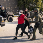 Secretary of Homeland Security Kristi Noem, not shown, visits with U.S. Immigration and Customs Enforcement officers at the ICE facility in Chicago to observe enforcement operations, Oct. 3, 2025. (DHS photo by Tia Dufour)